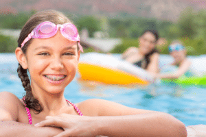 Child with braces swimming during summer in Gurnee, IL
